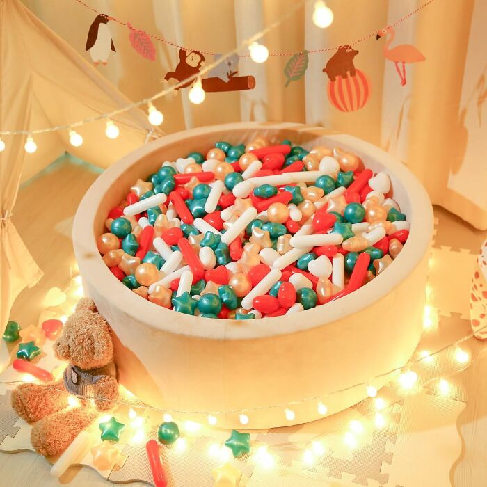 A Bag Of Christmassy Ballpit Sprinkles Will Turn Your Regular, Boring Ball Pit Into A Festive, Slightly Chaotic, And Deeply Instagrammable Winter Wonderland That You Will Be Finding Under Your Couch Cushions Until June