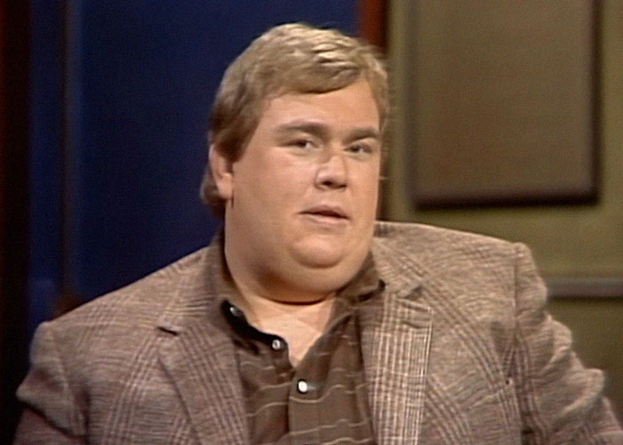 Man in a brown plaid jacket and shirt sharing stories about celebrities they’ve met and the vibes they gave off.