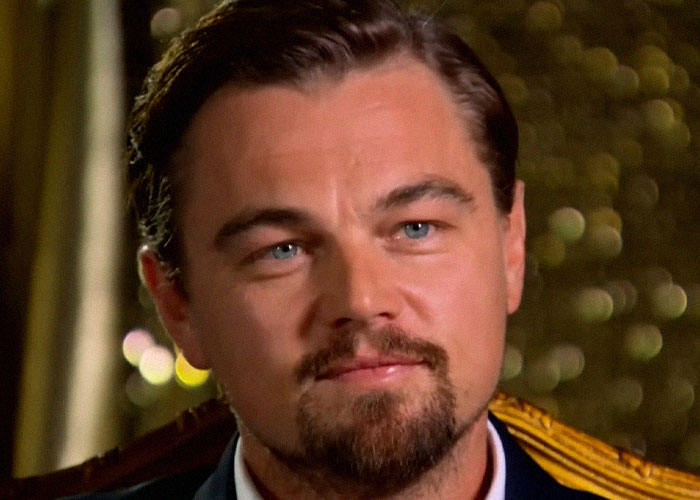 Close-up of a man with blue eyes and a beard, portraying celebrity vibes shared by people who have met famous figures.