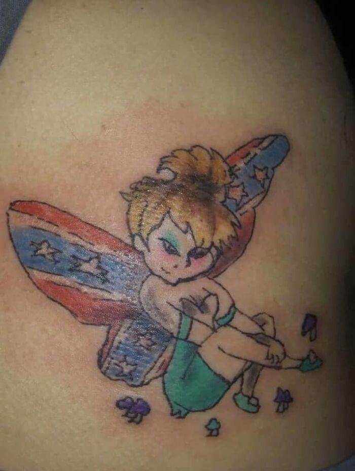 Tattoo of a fairy with poorly drawn features and American flag wings, part of worst tattoos collection making members cringe.