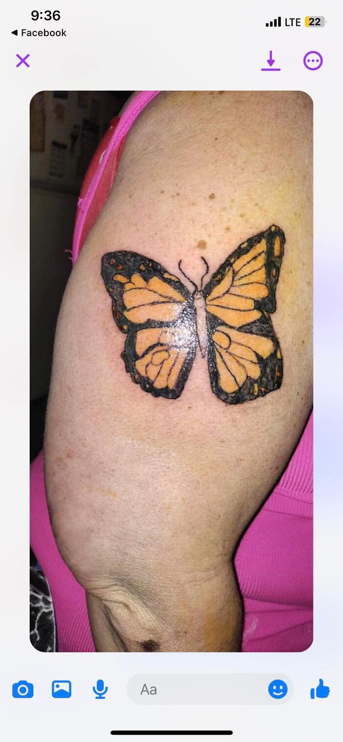 Tattoo of a butterfly on arm with uneven black outlines, showing one of the worst tattoos making members cringe in an online group.