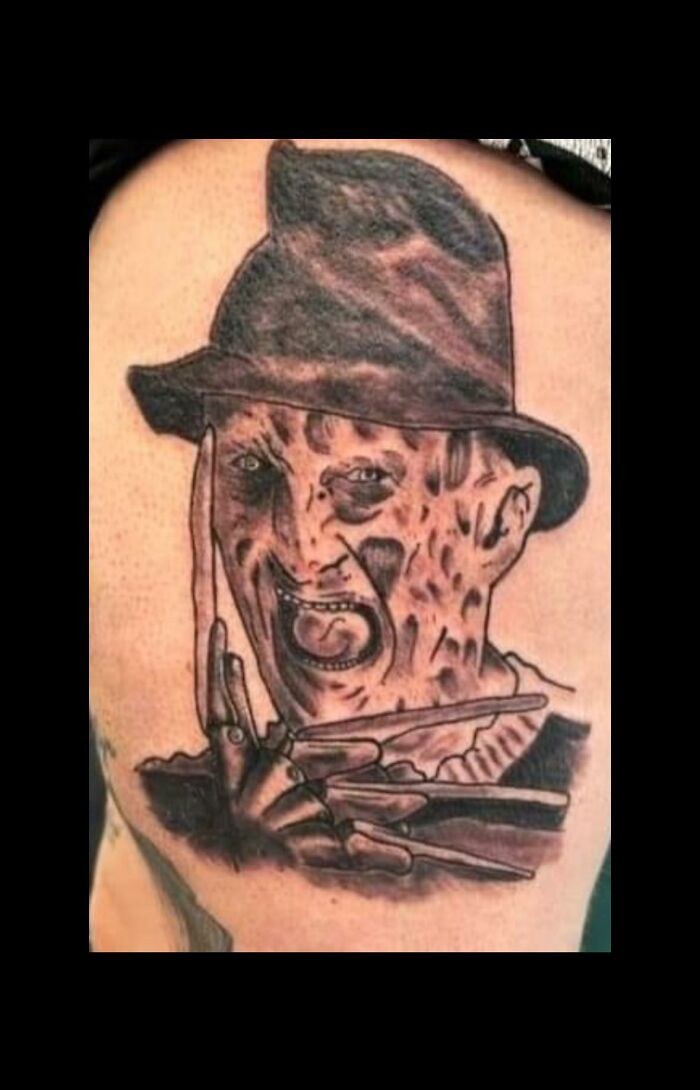 Tattoo of a horror character with a hat and clawed hand, featured in a group dedicated to the worst tattoos out there.