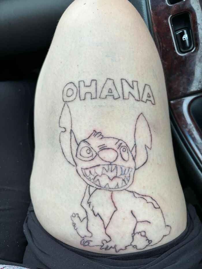 Outline tattoo of a cartoon character with the word OHANA above, shown as part of worst tattoos making members cringe.