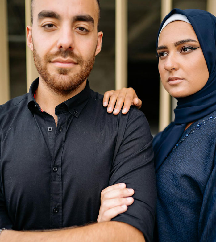 Young man and woman with serious expressions, capturing the dynamic of secretly gay teen and homophobic parents.