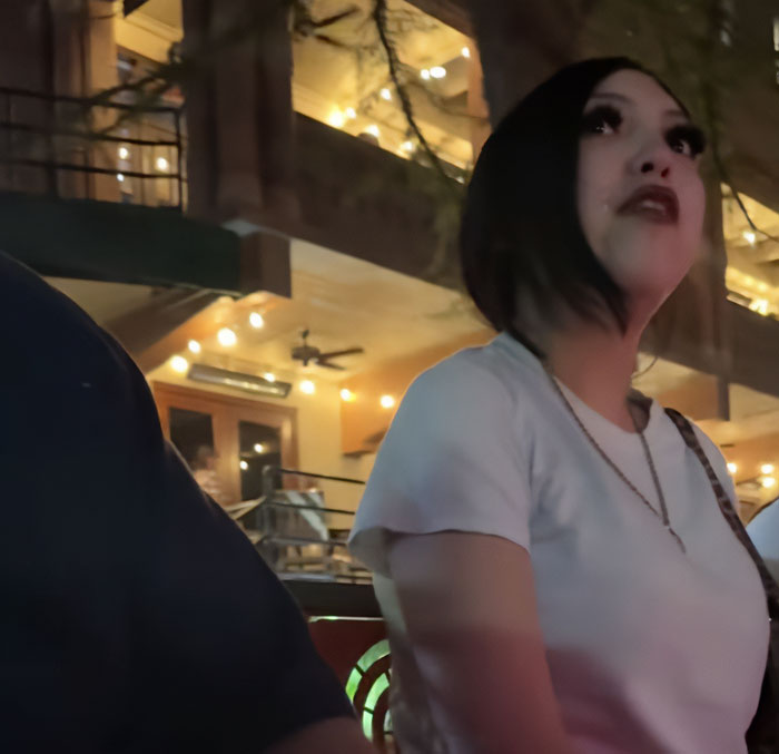 Teen taught harsh lesson by judge after pepper-spraying tourists on a boat, standing in dimly lit outdoor setting. Teen taught harsh lesson by judge after pepper-spraying tourists on a boat, standing in dimly lit outdoor setting.