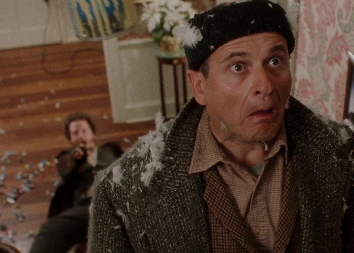 Man with shocked expression during a chaotic scene in Home Alone, highlighting viral then-and-now moments for millennials. Man with shocked expression during a chaotic scene in Home Alone, highlighting viral then-and-now moments for millennials.