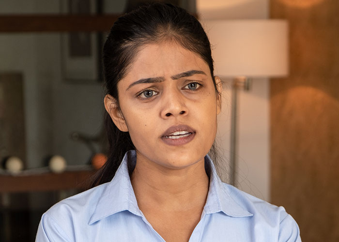 Woman looking frustrated and rethinking relationship after boyfriend salts entire pot of chili in a home kitchen setting