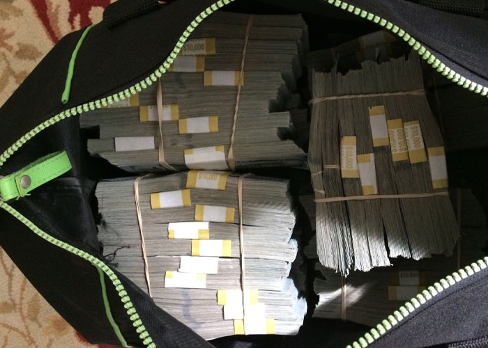Stacks of bundled money inside a duffle bag illustrating wealth in interesting today I learned facts and news alternatives