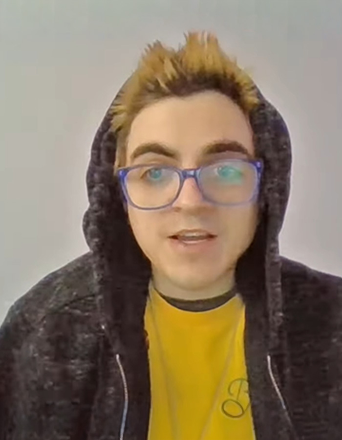 Former child actor Tylor Chase wearing glasses and hoodie discussing recent troubles in a casual indoor setting.