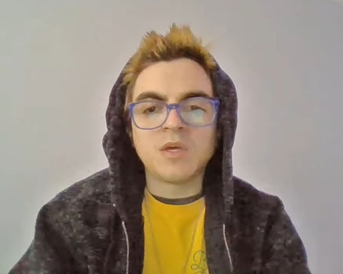 Nickelodeon star wearing glasses and hoodie in a heartbreaking video revealing struggle with homelessness and personal challenges.