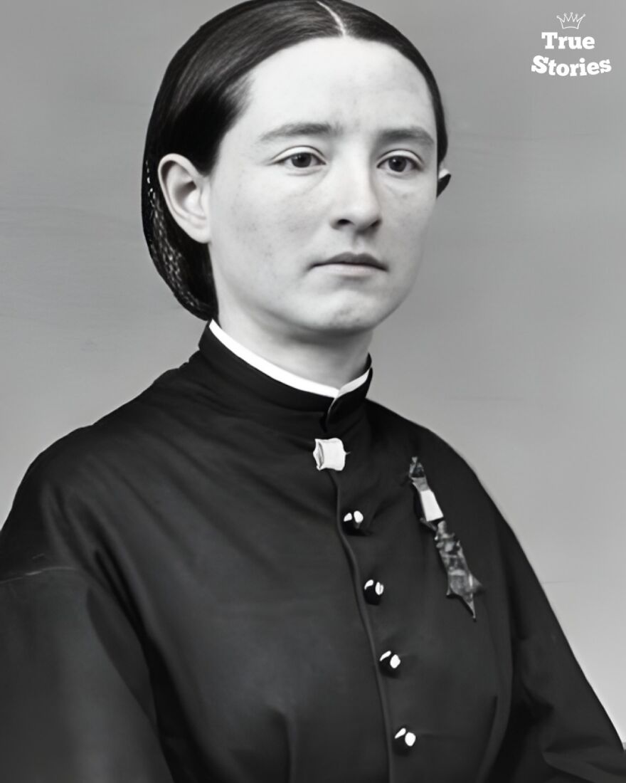 Black and white portrait of an important American personality from the 19th century wearing a dark dress with a medal.