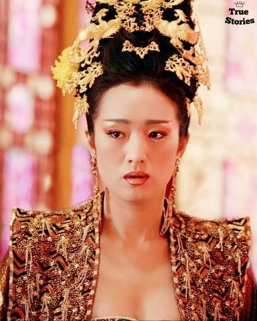 Asian woman in ornate traditional attire and gold headpiece, representing important American personalities in history.