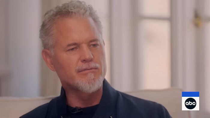 Middle-aged man with gray hair and beard sitting indoors during an interview about celebrities people think suffer.