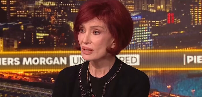 Female celebrity with red hair speaking in a studio setting, representing celebrities people think suffer.