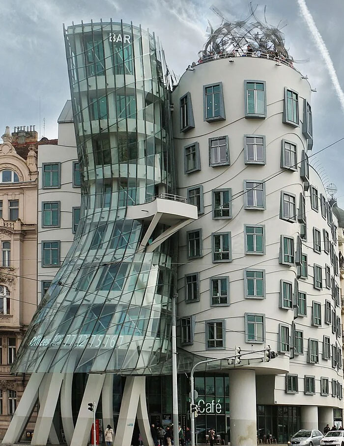 Dancing House with curved glass and unusual shapes, a unique example of weird buildings worldwide.