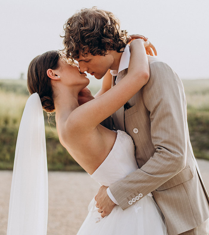 Couple embracing closely outdoors, symbolizing complex family relationships revealed by DNA tests about older sister and mom.