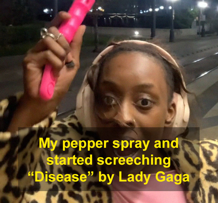 Woman holding pepper spray at night, using a period pad to scare off men stalkers on the street.