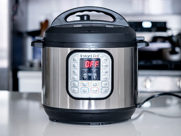 Instant Pot pressure cooker on kitchen counter representing worst gifts people have received.
