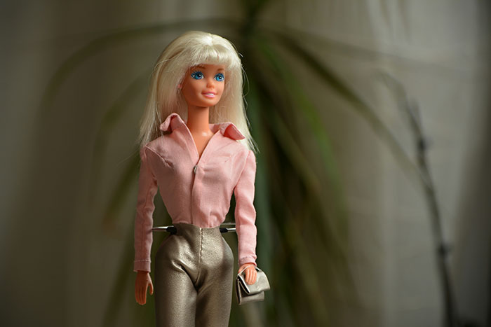 Barbie doll dressed in pink blouse and gold pants, representing one of the worst gifts people have ever received.