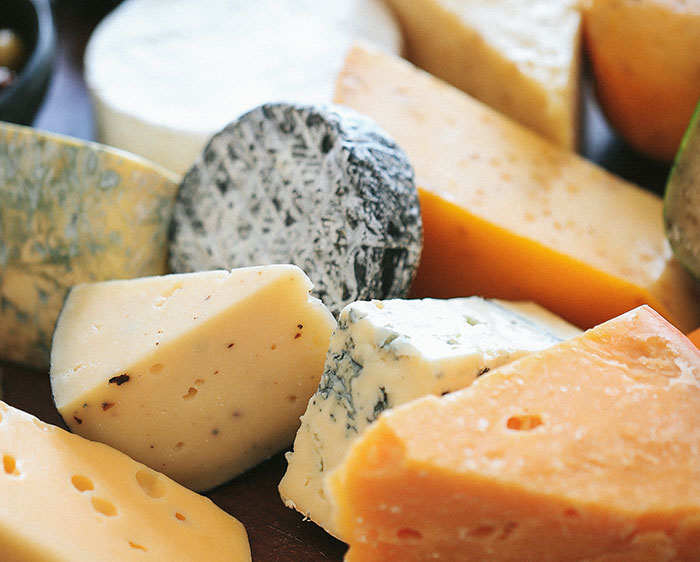 Assorted cheese wedges close-up with various textures and colors, illustrating worst proposal stories side-eye moments.