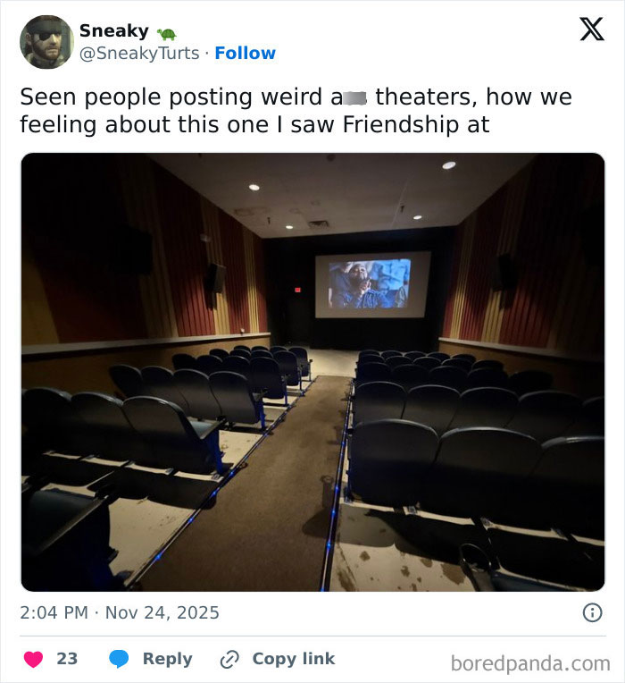 Dimly lit empty movie theater with stained floors and worn seats, illustrating some of the worst movie theaters experiences.