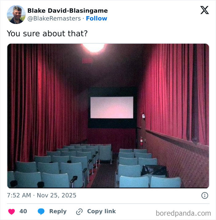 Small outdated movie theater with limited seating and dark red curtains illustrating worst movie theaters shared by people.