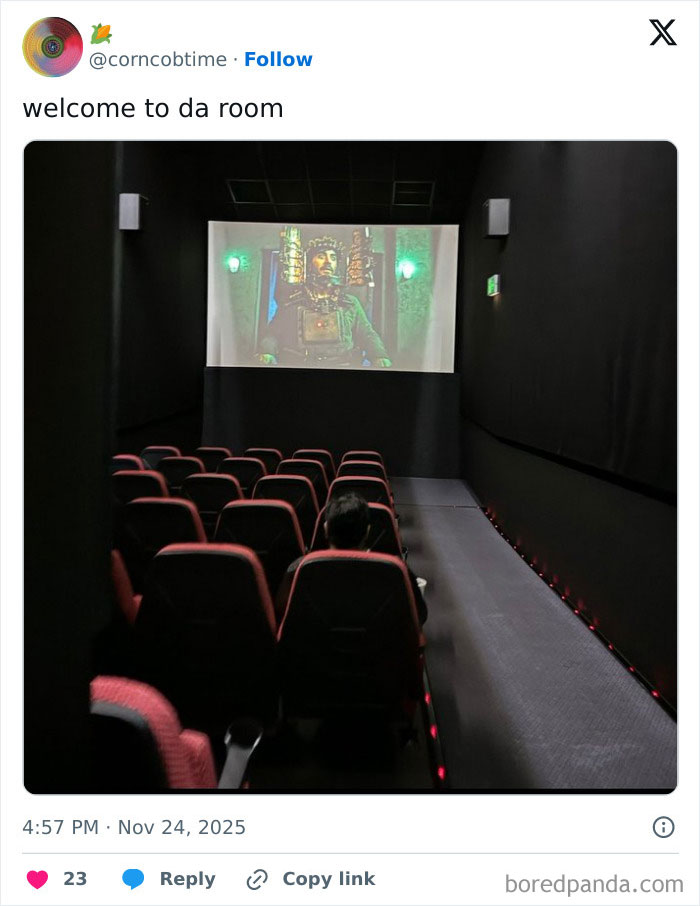 Small and dimly lit movie theater with limited seating, shown during a film screening, illustrating worst movie theaters experience.