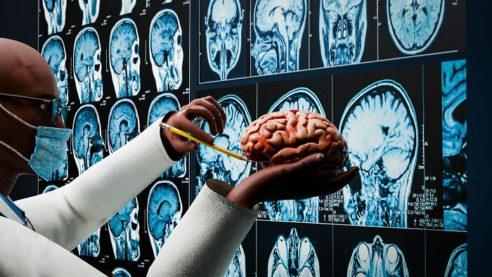 Scientist examining a brain model with brain MRI scans in the background, highlighting unsolved brain mysteries.