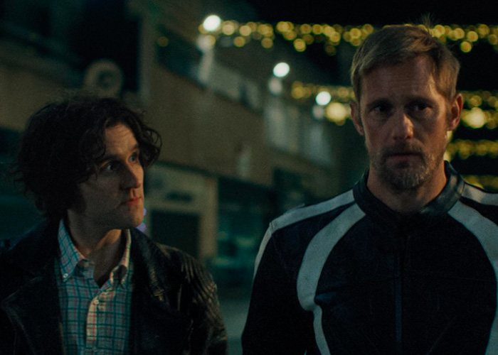 Alexander Skarsg&aring;rd in a nighttime scene, looking serious, referencing orientation after viral men and women comment.