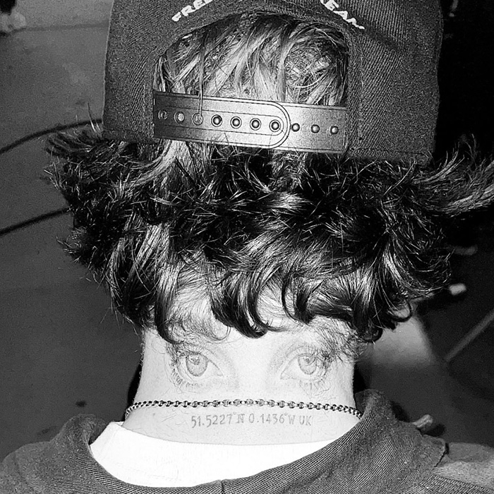 Black and white photo of a person with curly hair wearing a backward cap, relating to Beckham family prenup news.