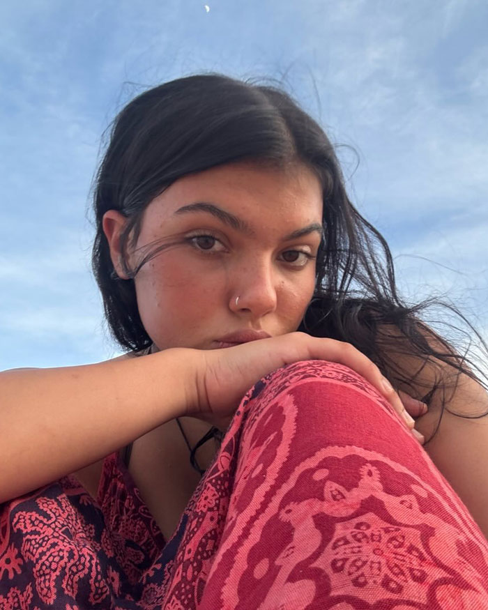 Canadian teen with dark hair and patterned clothing, highlighting autopsy results uncovering startling clues in dingo case.