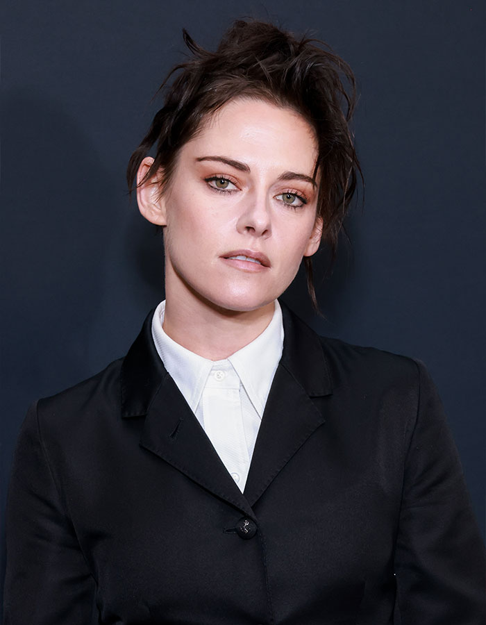 Kristen Stewart in black suit and white shirt, hinting at a deeper reason behind her possible exit from the US.