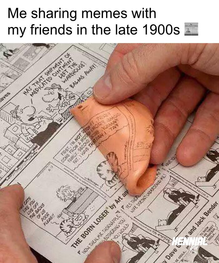 Hand holding a folded comic strip in a newspaper, evoking nostalgic memories from late 1900s for Xenials.