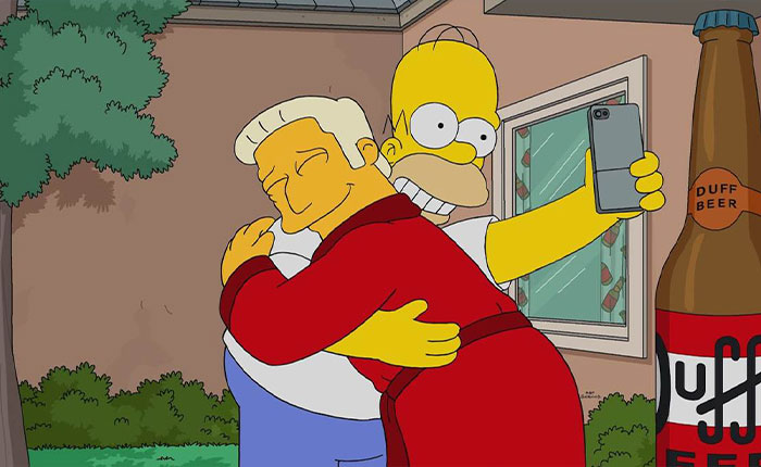 Homer Simpson hugging man and taking selfie beside Duff Beer bottle, Simpsons 2026 predictions