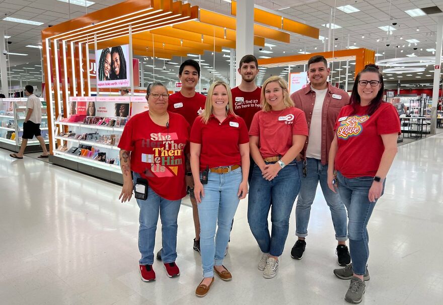 Retail workers standing together inside a store, illustrating jobs that often face work-life balance disasters.
