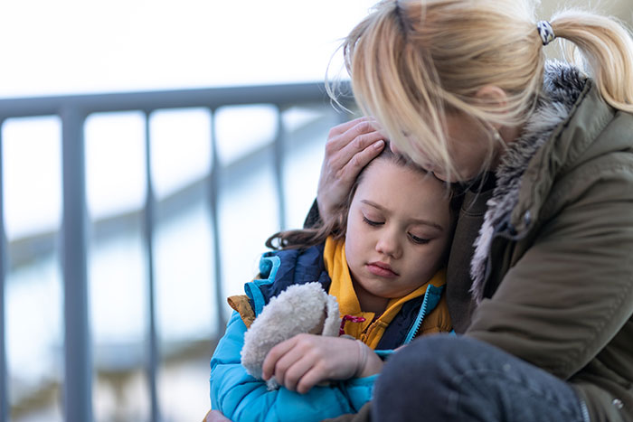 Mother comforting sad child outdoors, illustrating a dad accused by his own kids and how his life fell apart.