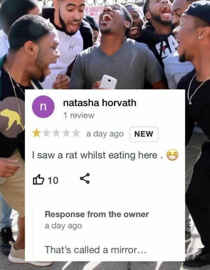 Group of men laughing while viewing a funny screenshot of a one-star review and witty owner response.