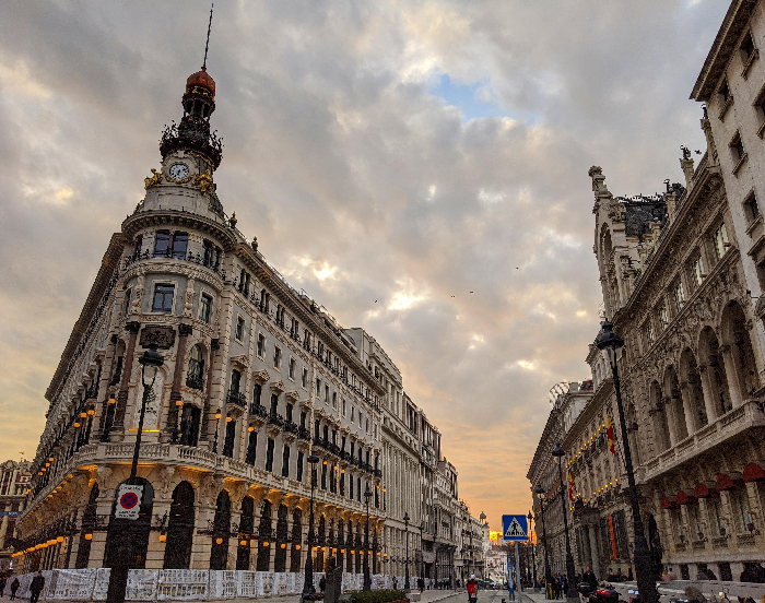 Historic European city street at sunset, illustrating best countries to raise a family with safe urban environments.