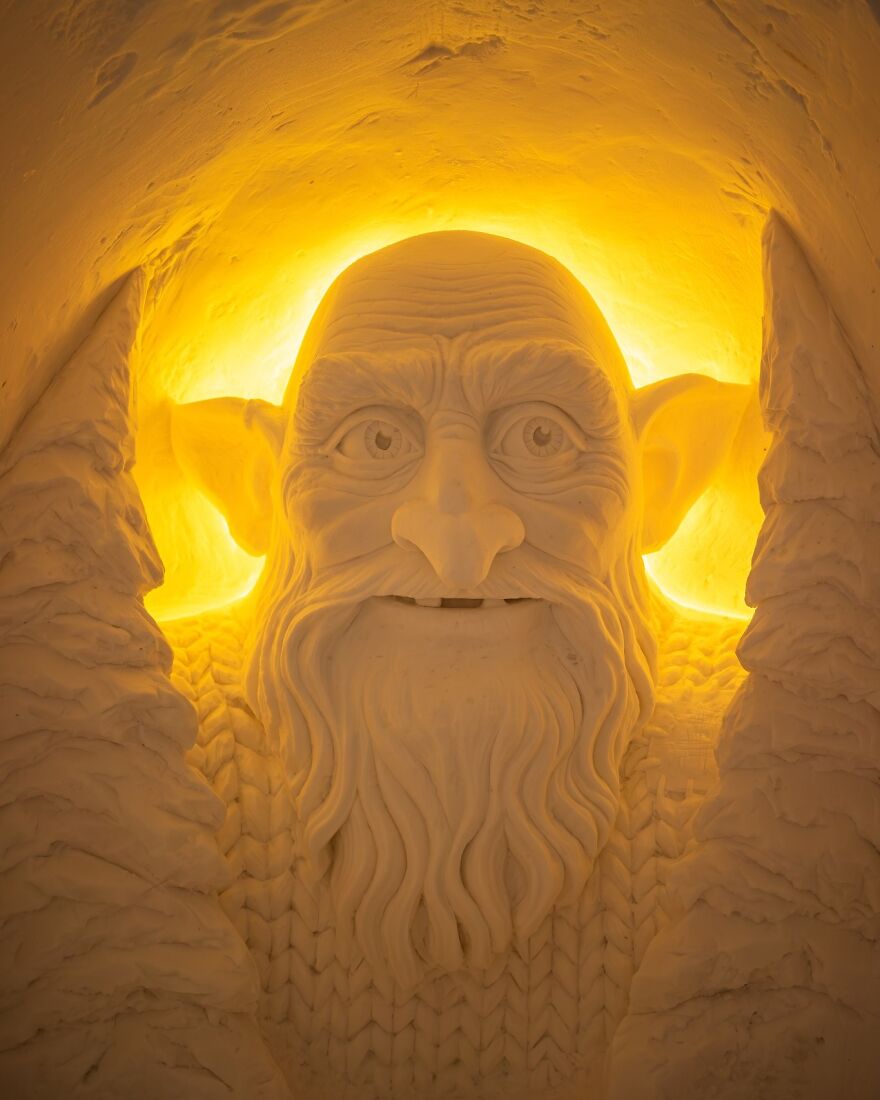 Glowing detailed sculpture of a mythical creature carved in stone, a unique place you should visit at least once.