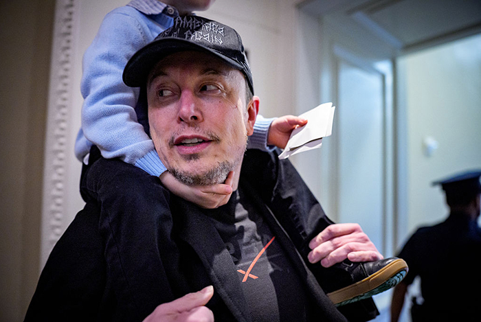 Elon Musk carrying a child on his shoulders, highlighting his 14 children across multiple mothers and years.