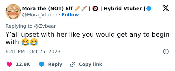 Screenshot of a Twitter reply showing a user defending a woman targeted by men after going viral for breast reduction.