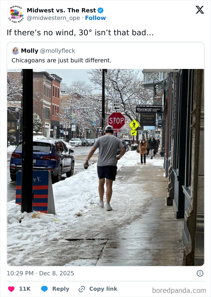 Man in shorts and t-shirt walking on a snowy Midwest street, showcasing Midwest life resilience in winter weather.