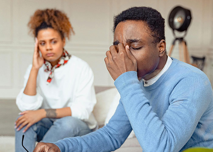 Husband throwing a full-blown tantrum while wife looks frustrated and refuses to follow his demands at home.