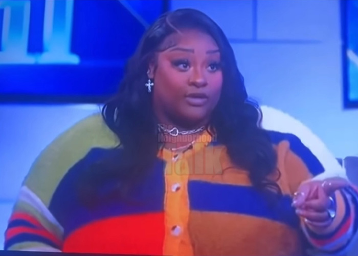 TikTok influencer wearing colorful sweater and necklace, discussing situation involving inappropriate act and $1.75M debt.