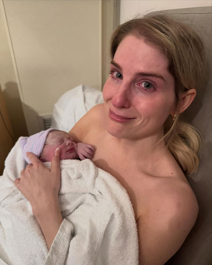 Meghan Trainor holding her newborn baby, emotional and smiling, highlighting surrogate journey and motherhood moments. Meghan Trainor holding her newborn baby, emotional and smiling, highlighting surrogate journey and motherhood moments.