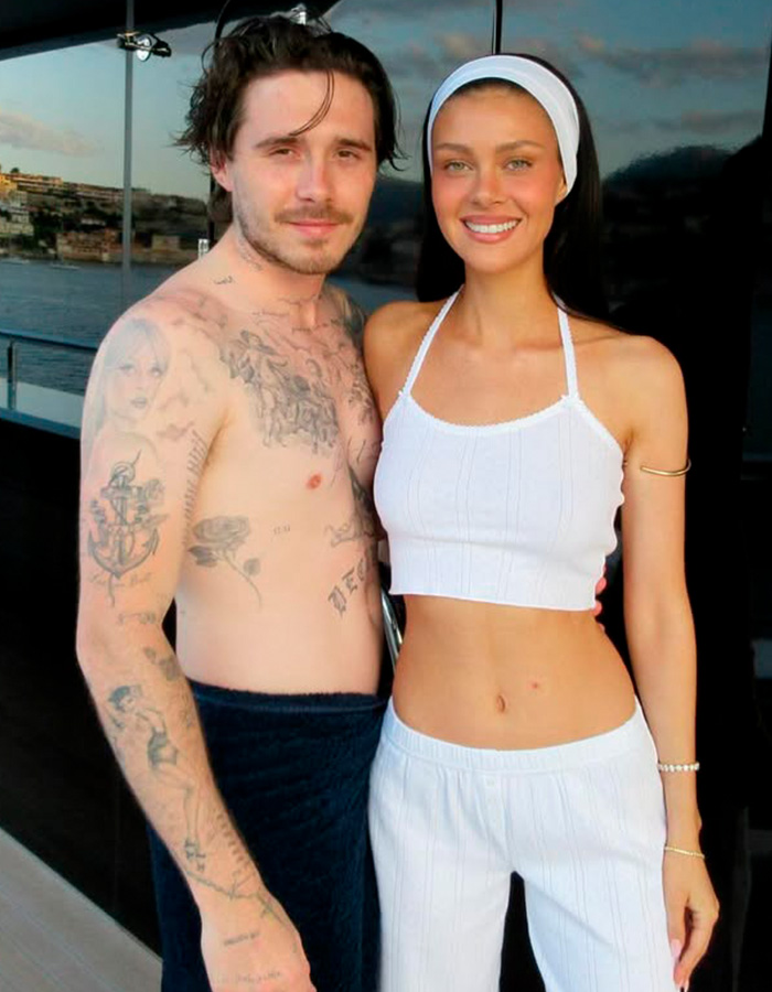 Brooklyn Beckham with woman, showing tattoos and casual wear, related to Beckham family feud and prenup with Peltz family.