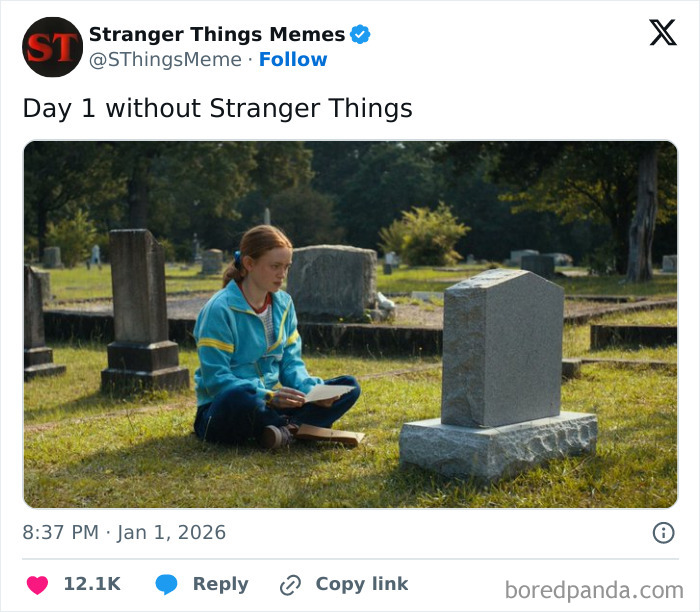 Young woman in blue jacket sitting alone by a tombstone symbolizing the end of Stranger Things after 10 years.