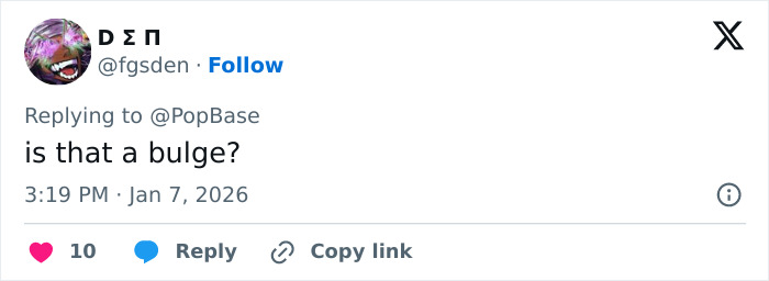 Tweet reply to PopBase reading is that a bulge? under photo of celebrity wax figure, user avatar and timestamp visible
