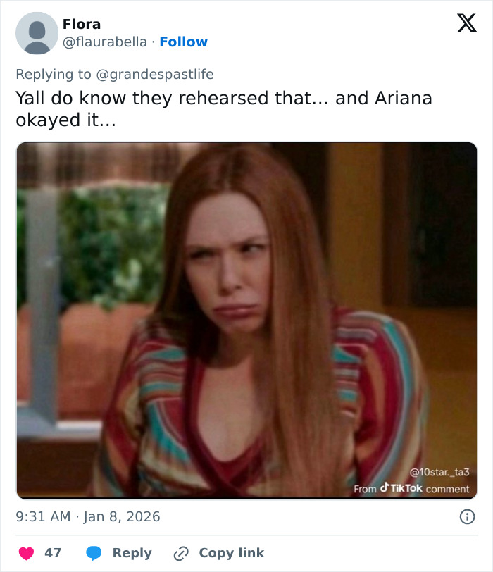 Woman with long red hair making an uncomfortable face related to Ariana Grande and Madonna performance backlash.