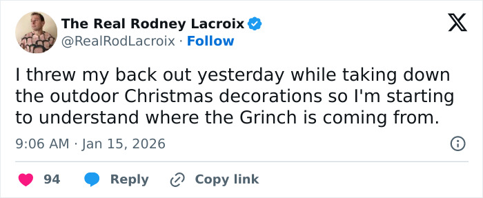 Tweet about throwing out a back while taking down Christmas decorations, relatable to dads and husbands humor.